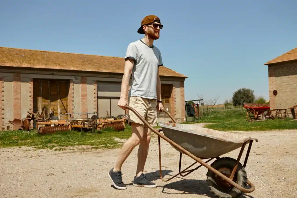 Hiring Amish Deck Builders in Pittsburgh? Everything You Need to Know 3 portrait handsome young male hipster snapback sunglasses carrying trolley from warehouse